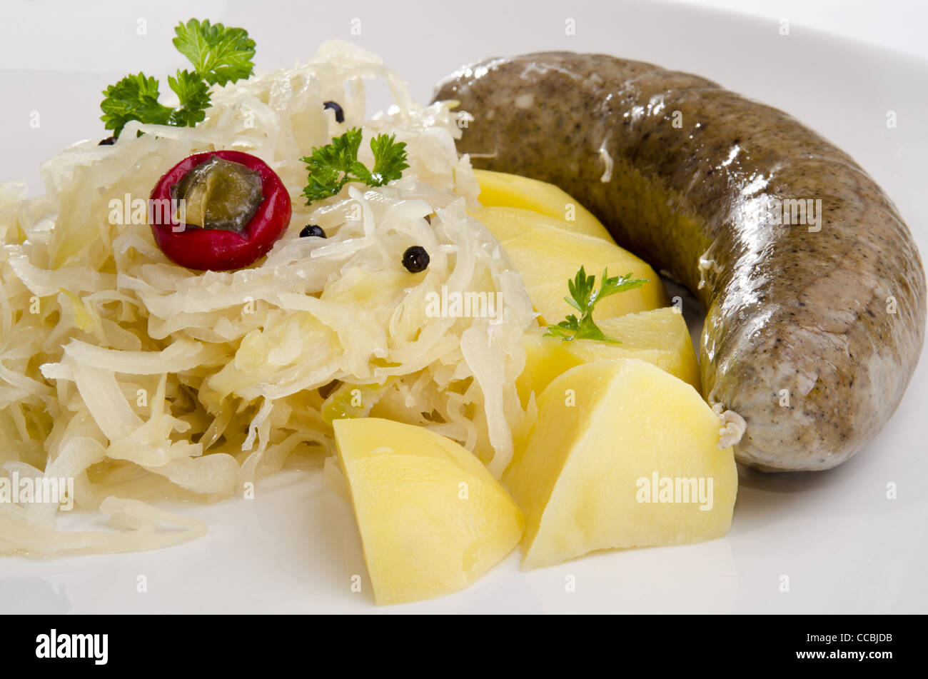 Steamed sauerkraut with grilled pork and potatoes Stock Photo