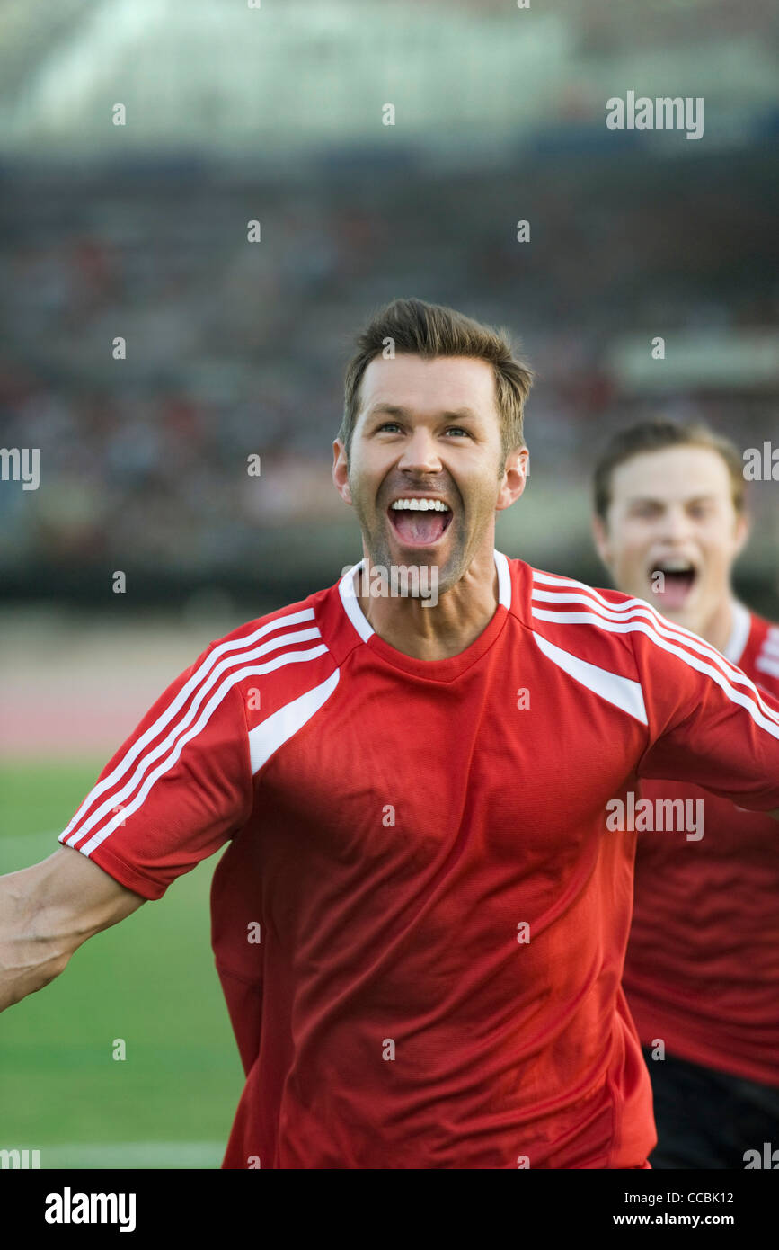 Soccer players shouting in victory Stock Photo