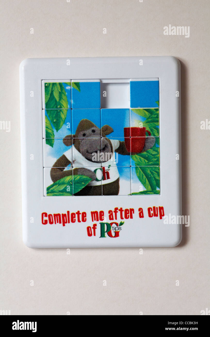 Complete me after a cup of PG Tips tea slide puzzle sliding puzzle isolated on white background Stock Photo