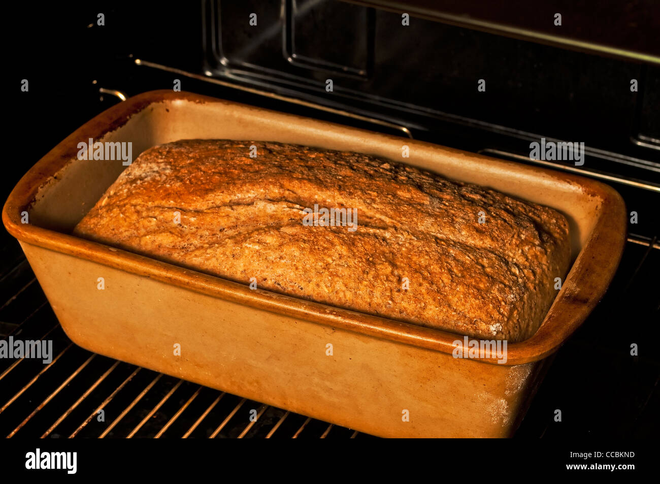 whole grain bread in an oven Stock Photo