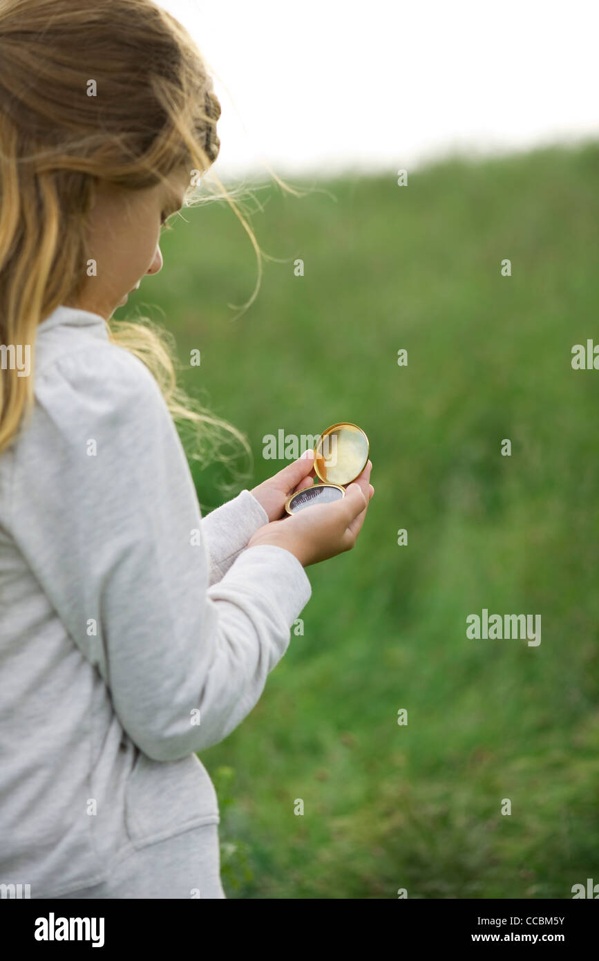 Girl using compass Stock Photo Alamy