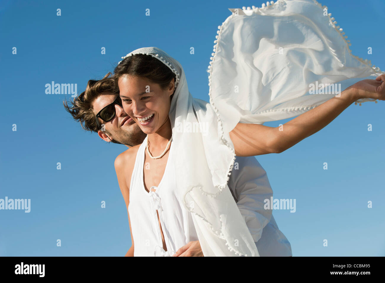 Bride and groom embracing outdoors Stock Photo