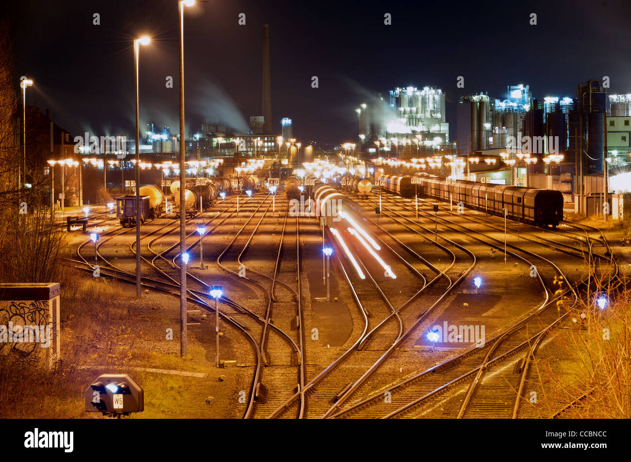 Evonik chemical factory and rail freight terminal at night, Wesseling, Cologne, North Rhine-Wesphalia, Germany. Stock Photo