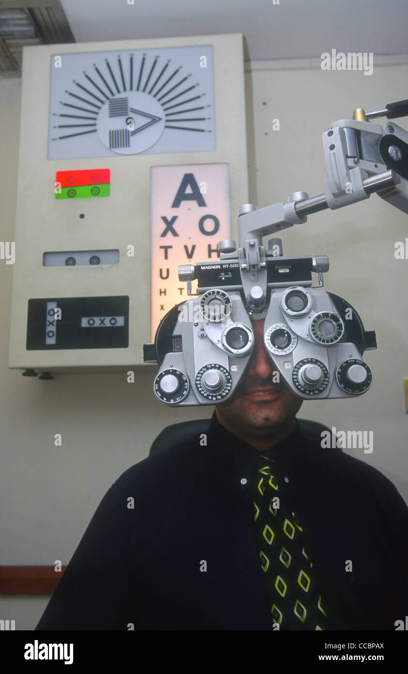 Customer having sight test at an opticians, London, UK. Stock Photo
