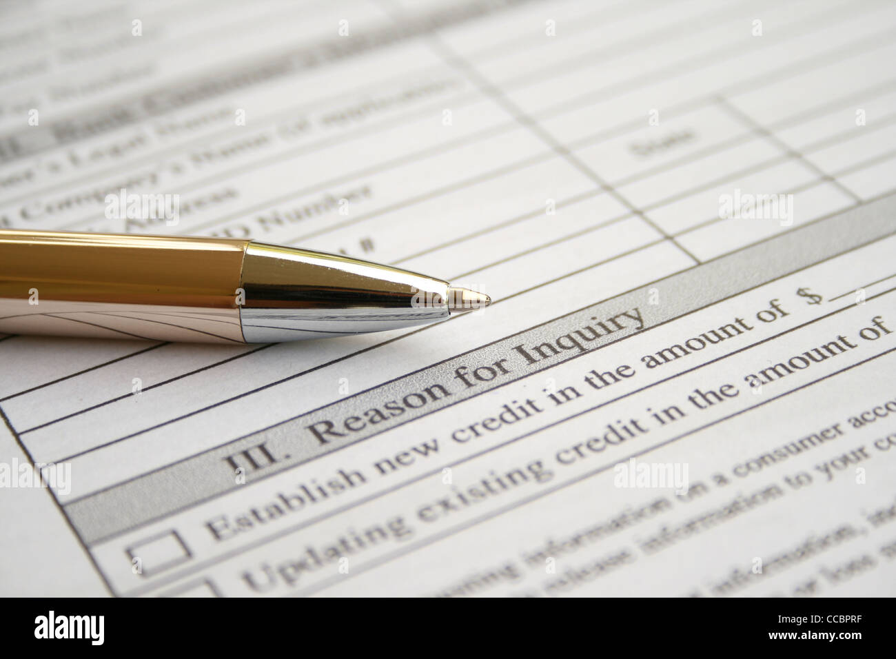 golden pen on gray document paper Stock Photo - Alamy