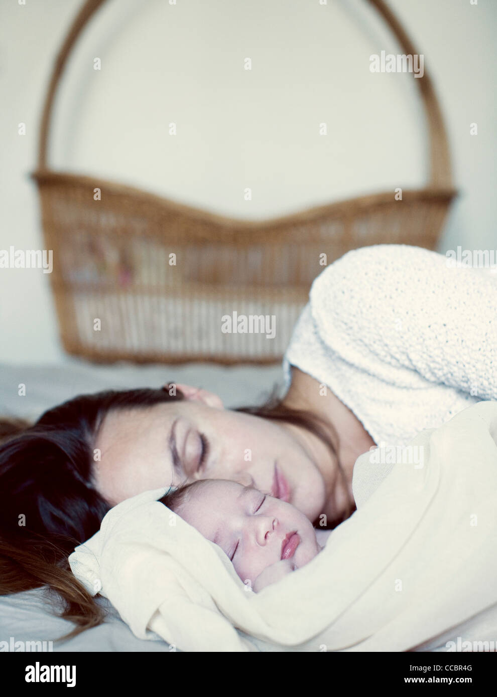 New born baby and mother sleeping in bed Stock Photo Alamy