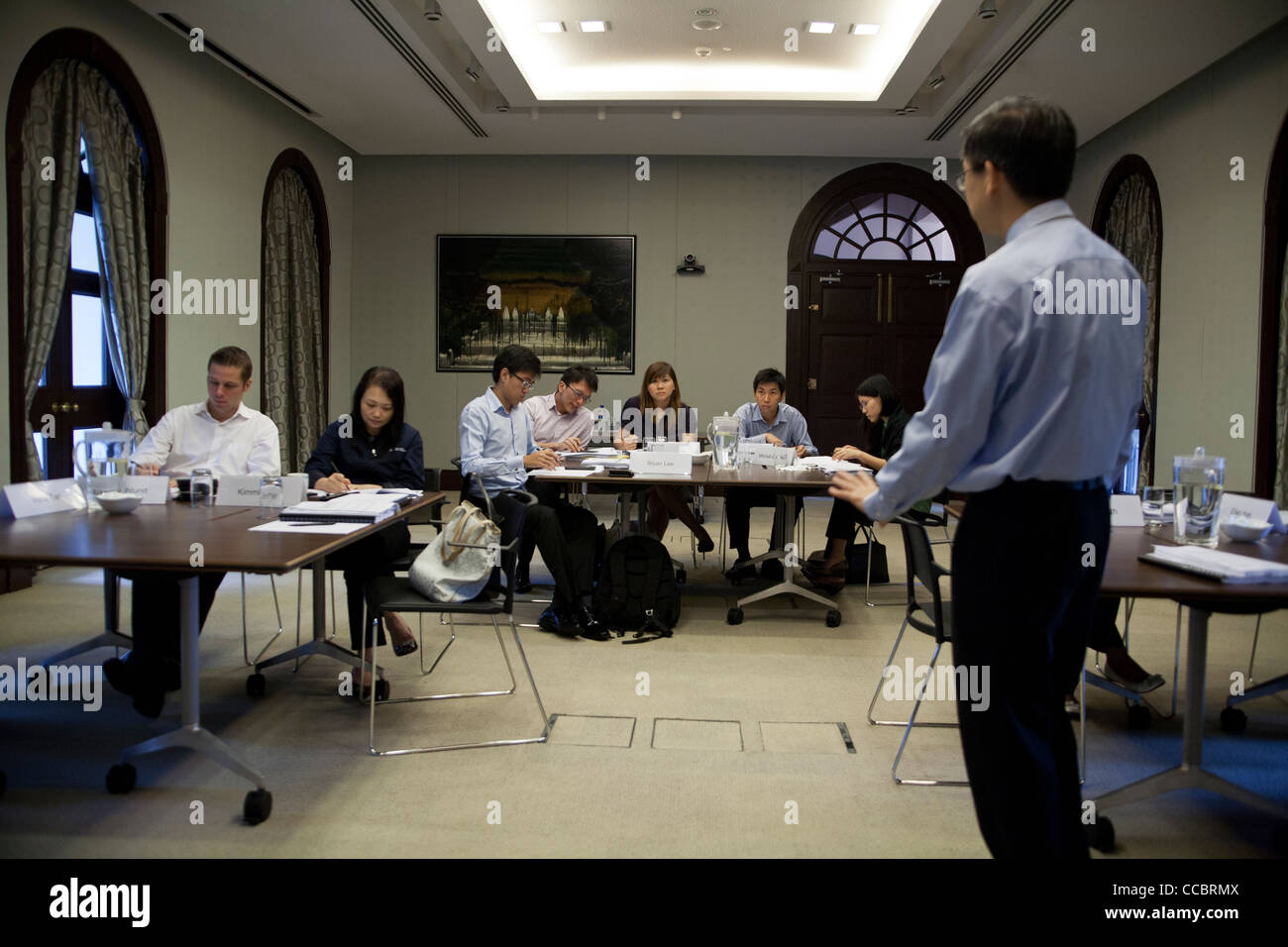 Students take part in a seminar at the UBS Business University in Singapore Stock Photo