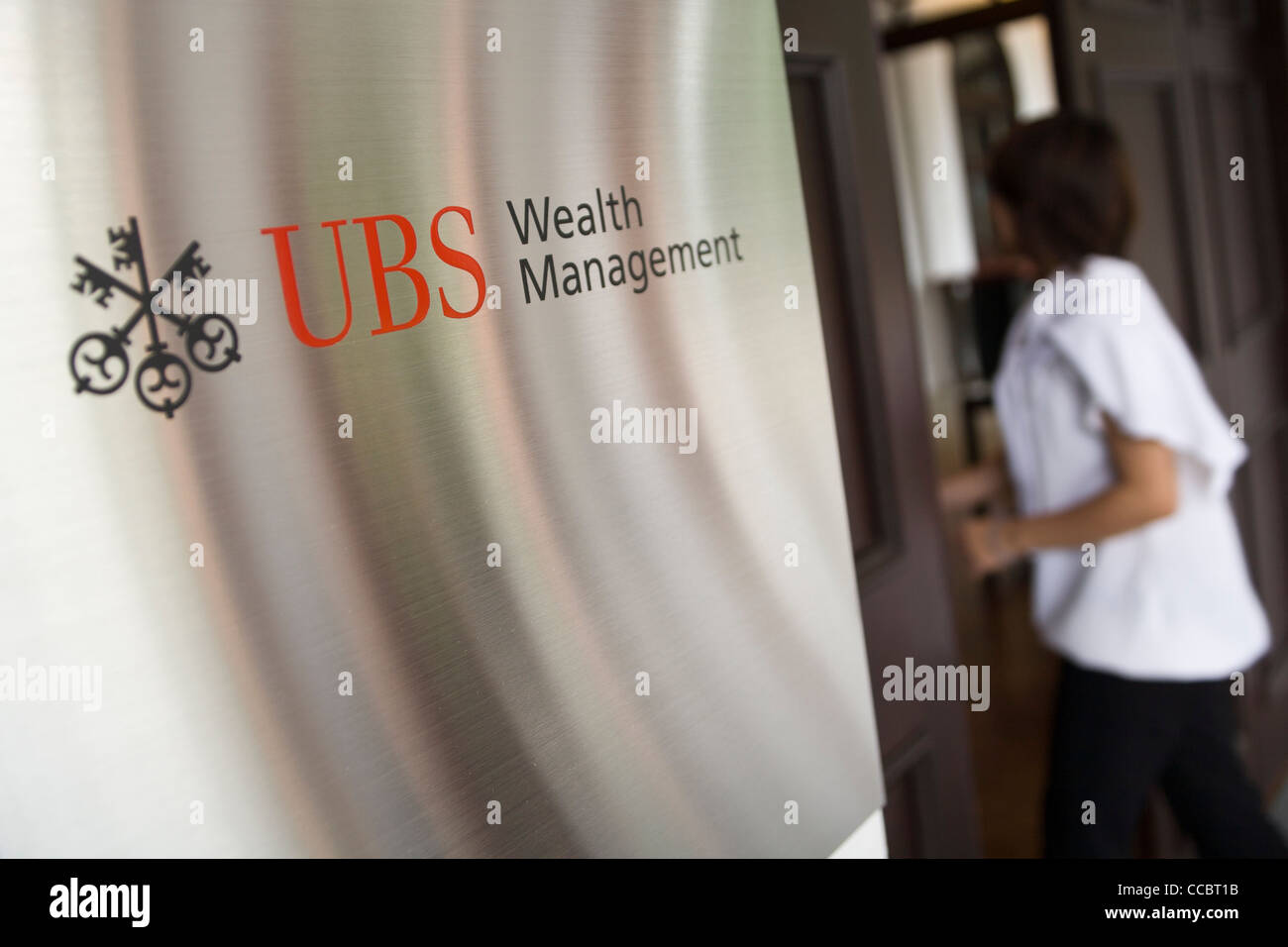 Signage on the exterior of the UBS Business University in Singapore Stock Photo