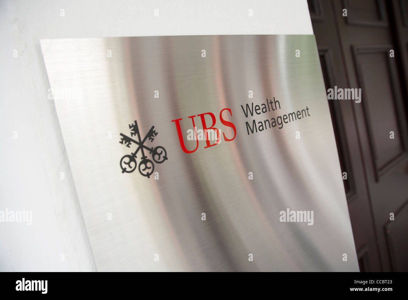 Signage on the exterior of the UBS Business University in Singapore Stock Photo