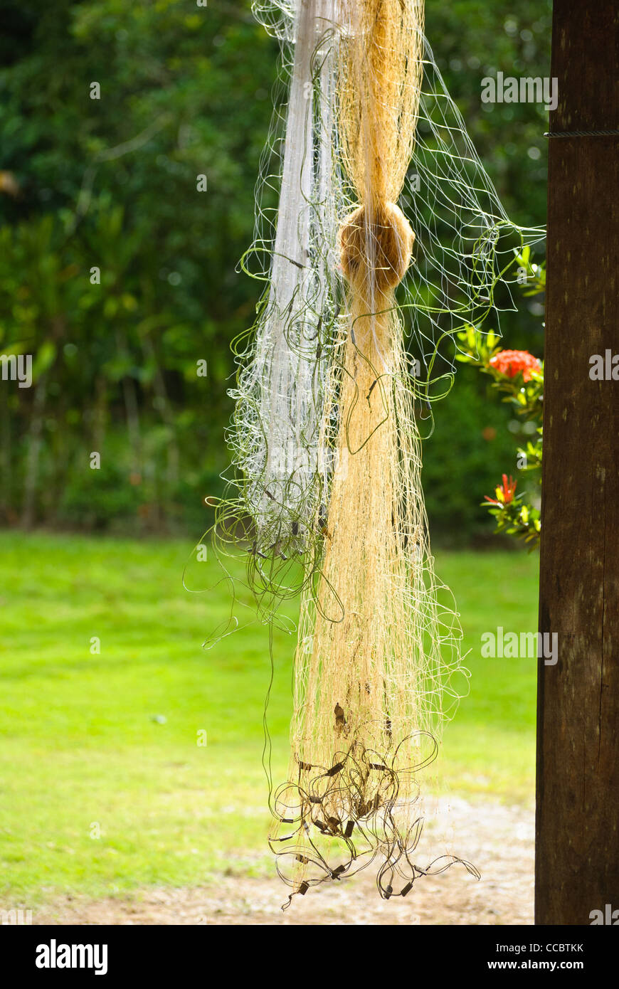 Fishing net hanging in a house showing the way of living of the people who live here. Stock Photo