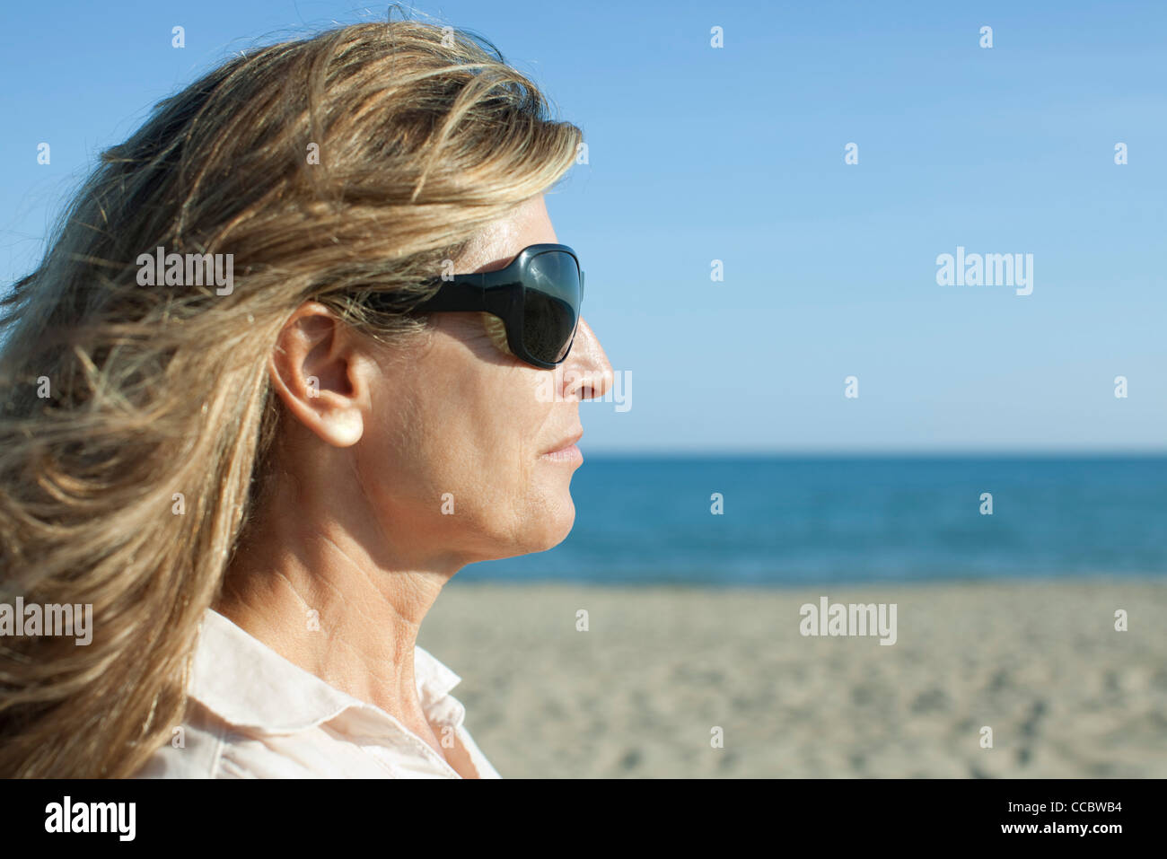 Woman at the beach, portrait Stock Photo