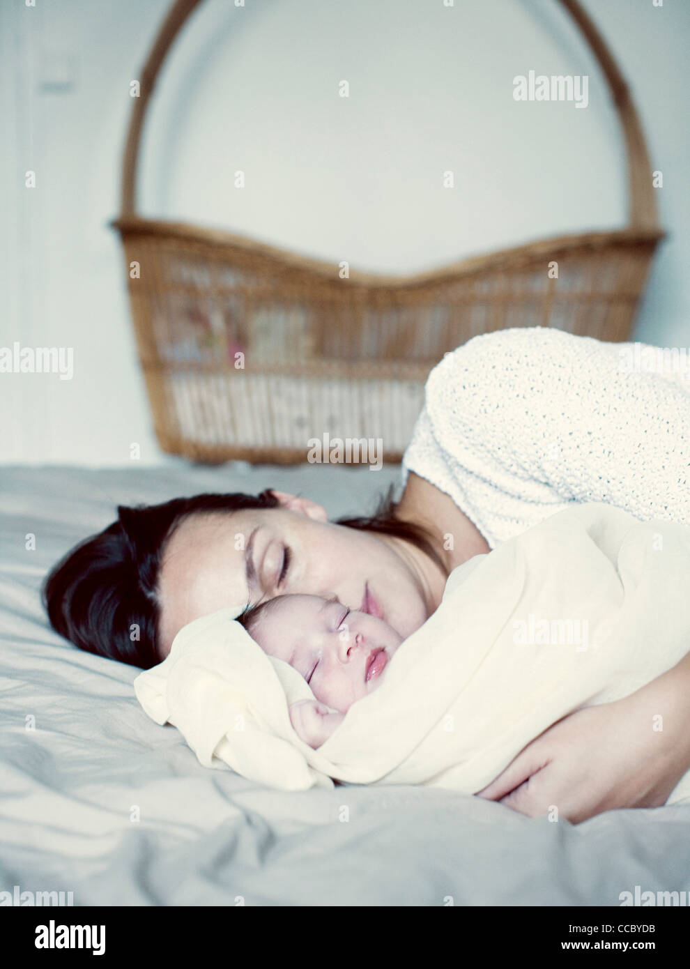 Mother and new born baby sleeping in bed Stock Photo Alamy