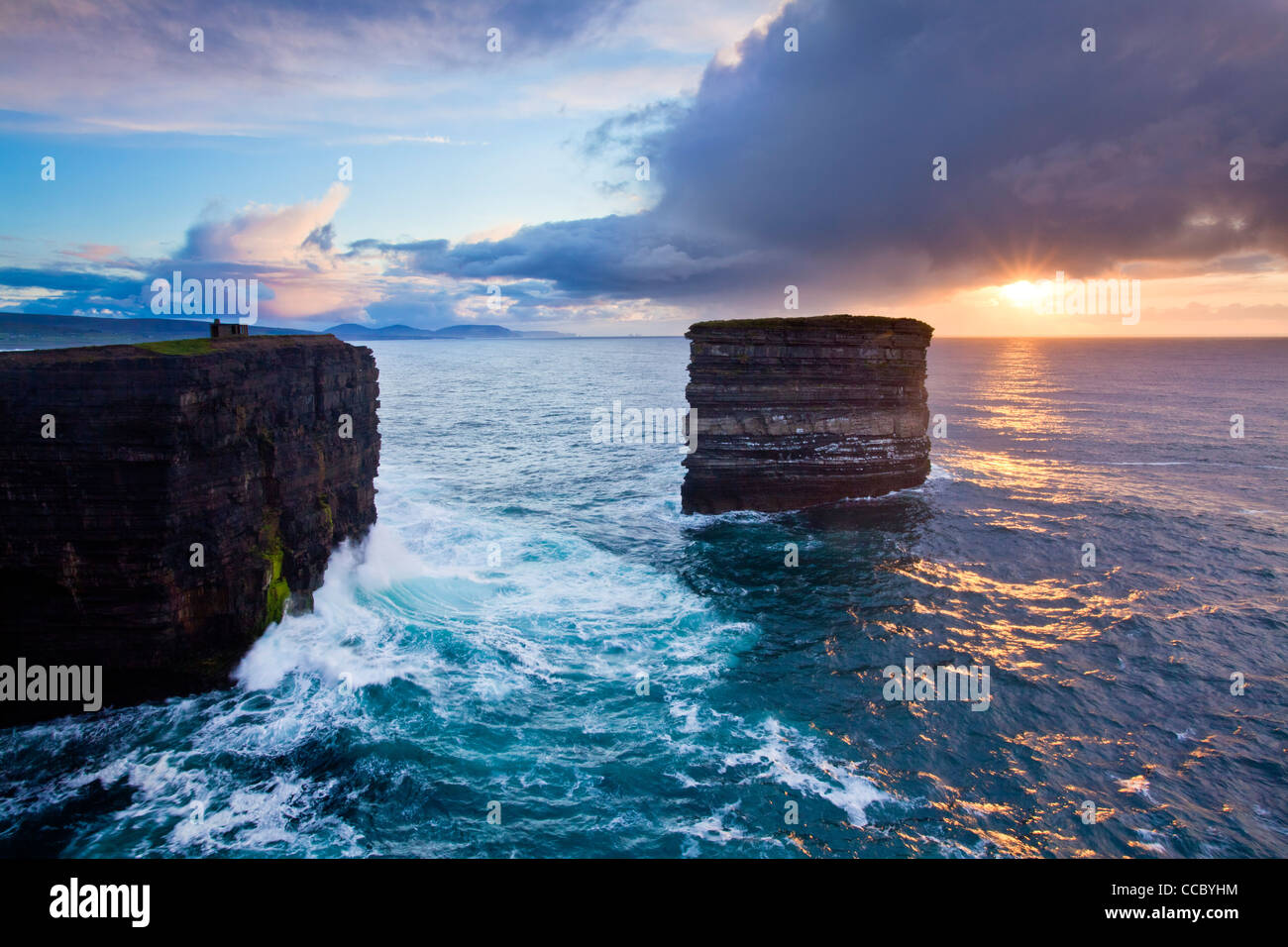 Sunset at the seastack of Dun Briste, Downpatrick Head, County Mayo, Ireland. Stock Photo