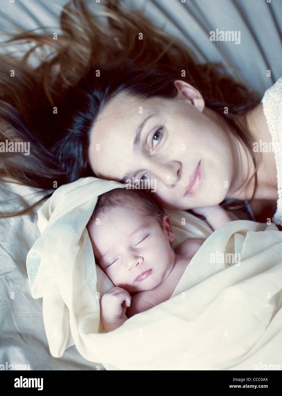 Mother and her sleeping new born baby, portrait Stock Photo - Alamy