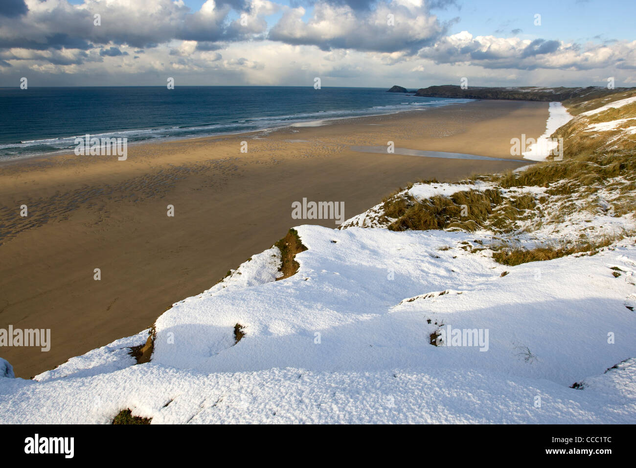 Snow on the coast path overlooking Perranporth beach, Cornwall. Stock Photo