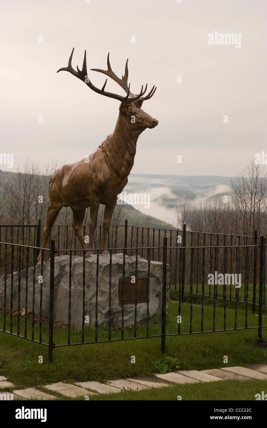 A bronze elk statue looks over Route 2, also know as the Mohawk Trail, in Florida, Massachusetts. Stock Photo