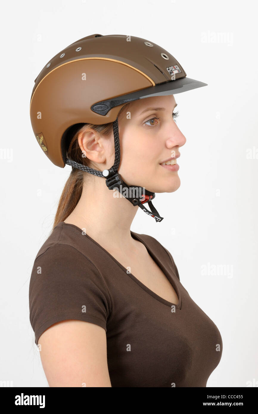 Young woman wearing a modern riding hat Stock Photo