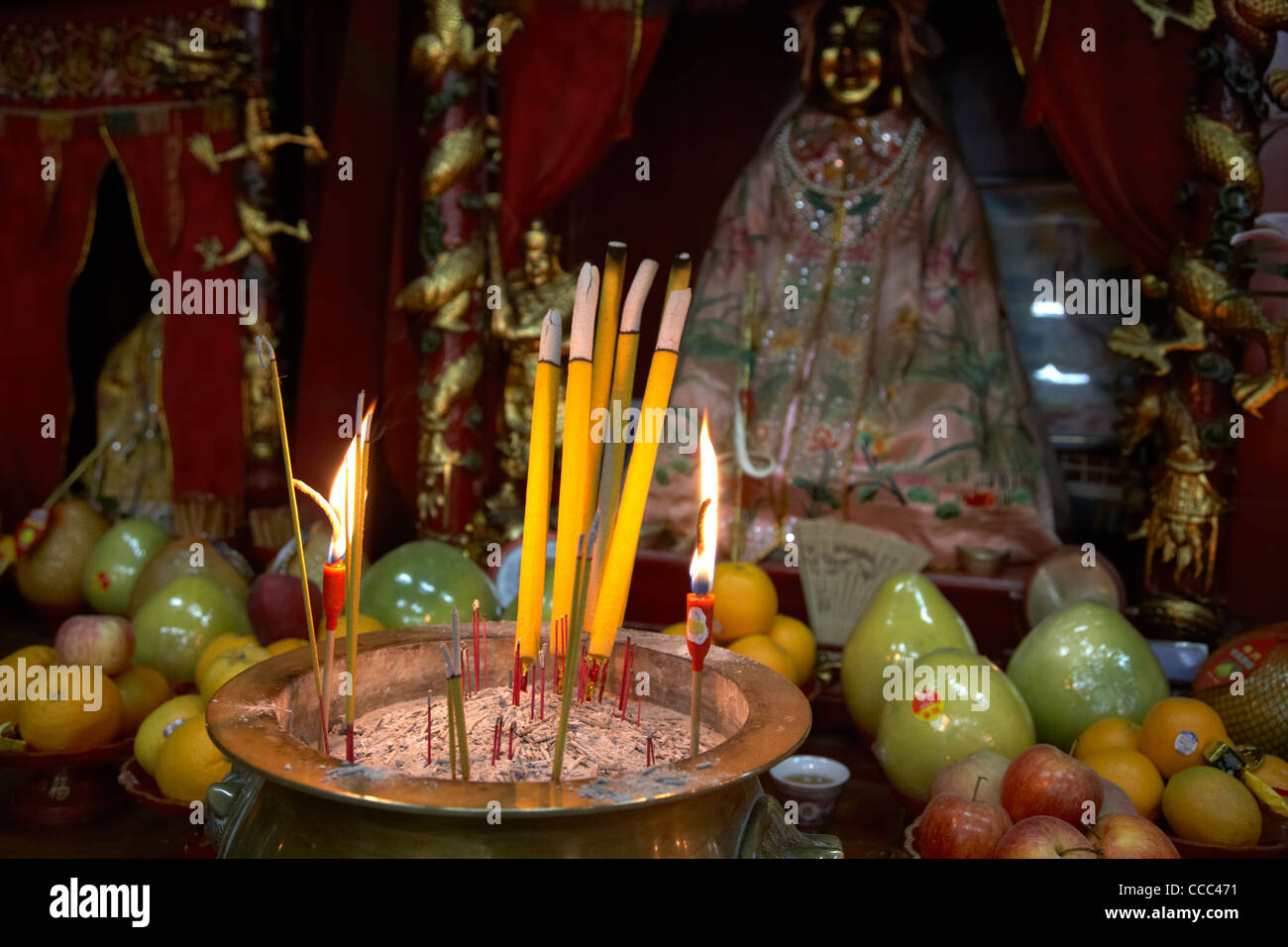 burning incense and joss sticks as offerings in tin hau temple stanley