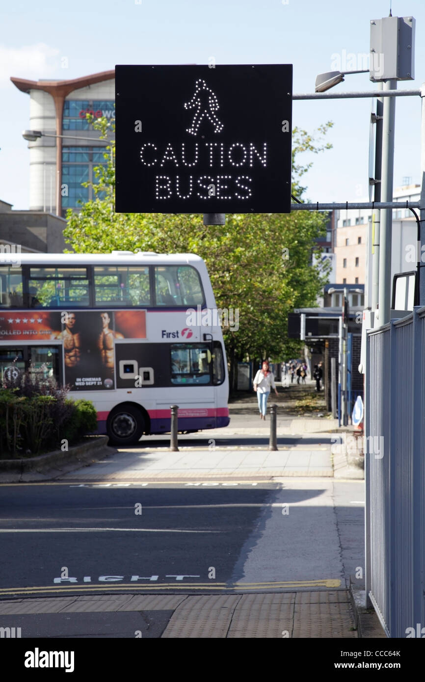 Bus Warning Sign to pedestrians, UK Stock Photo