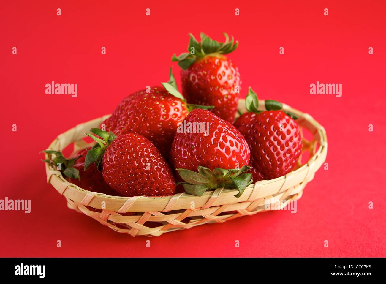Strawberry in wicker basket Stock Photo