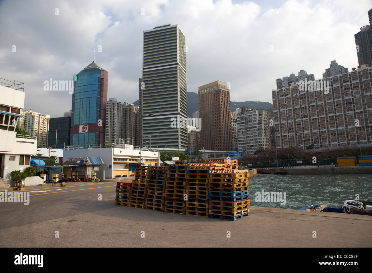 wooden pallets piled up small pier in western district hong kong hksar