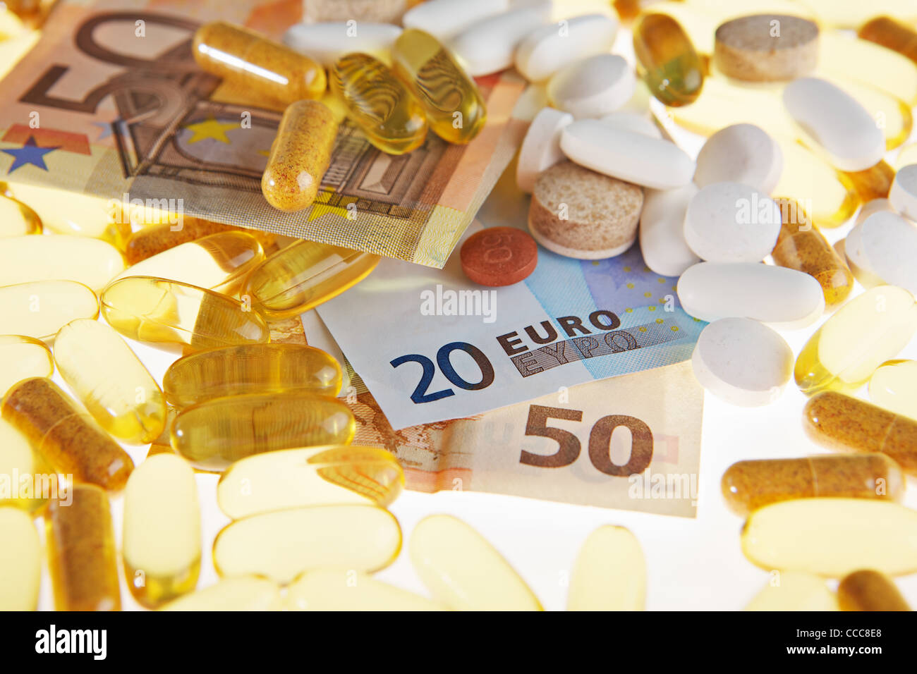 Pills and the euro on a white background Stock Photo