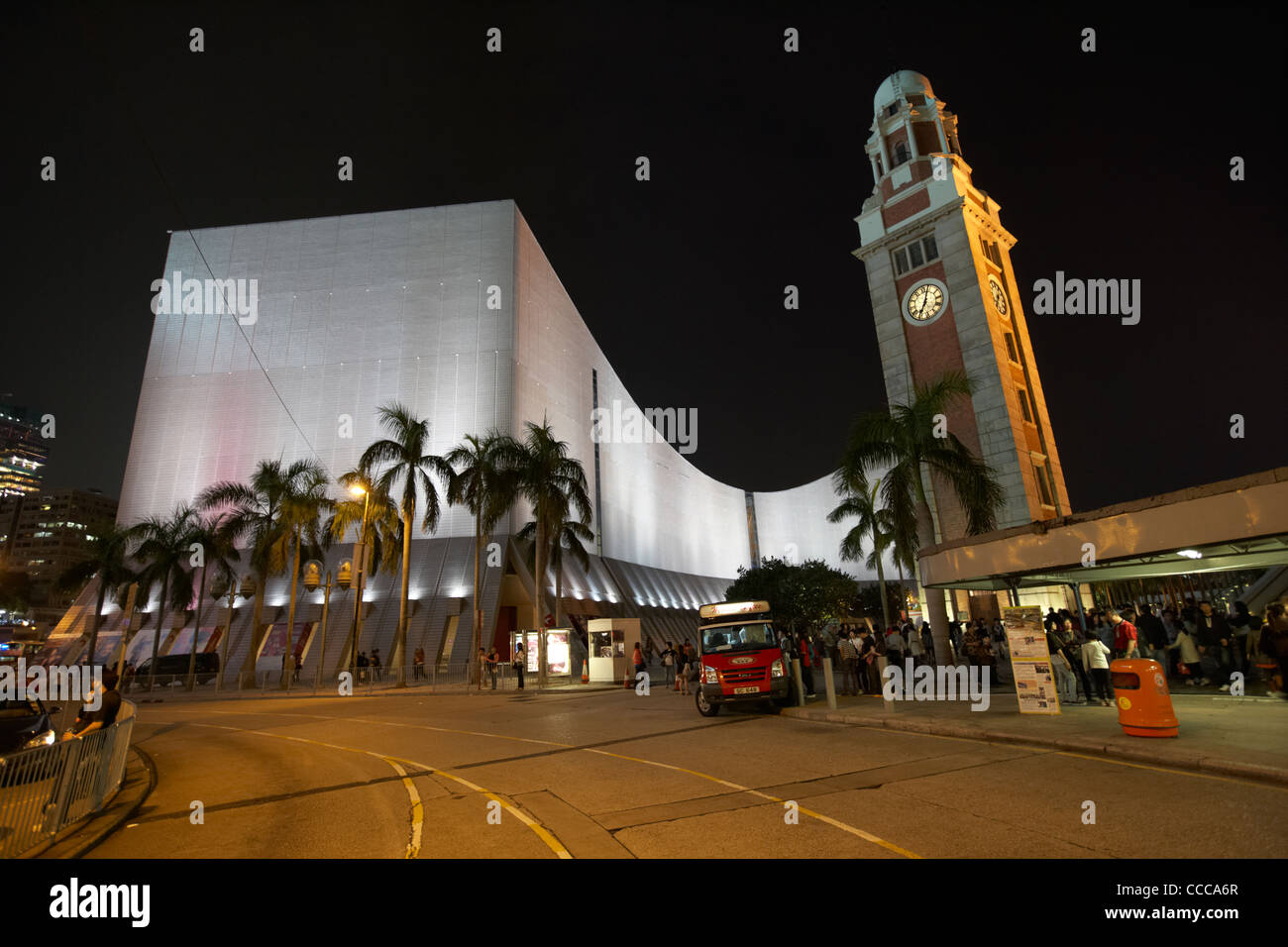 hong kong cultural centre and clock tower illuminated in kowloon at