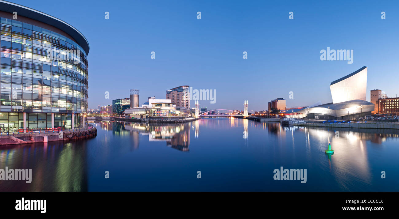 BBC Studios Media City, Lowry Centre & Footbridge and Imperial War Museum (North) at Night, Salford Quays, Manchester, England Stock Photo