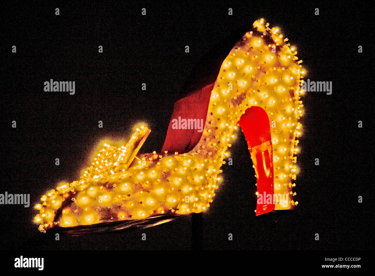 A giant illuminated high heel shoe decorates Las Vegas Boulevard in Las Vegas, NV, as part of the 'Neon Boneyard Park' signs. Stock Photo