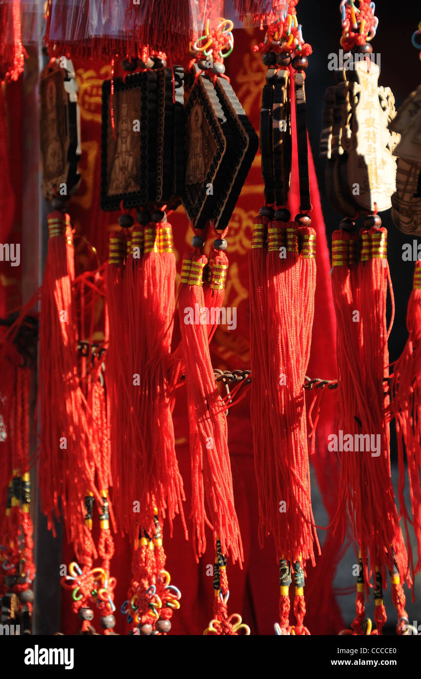 Feng shui tassels on wish tokens at a temple Stock Photo