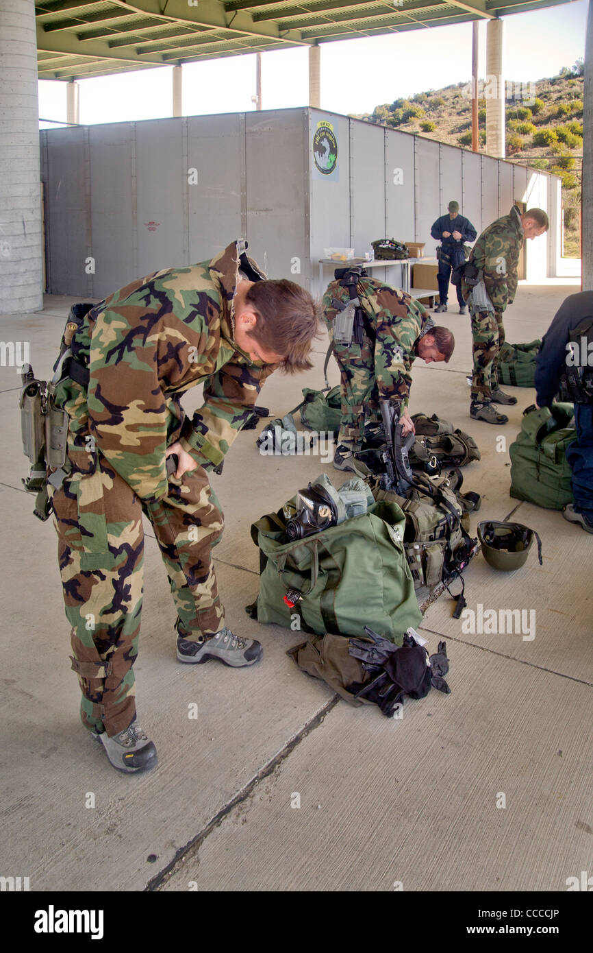 FBI SWAT (Special Weapons and Tactics) team members wear specialized 'Weapons of Mass Destruction' equipment for training drills Stock Photo