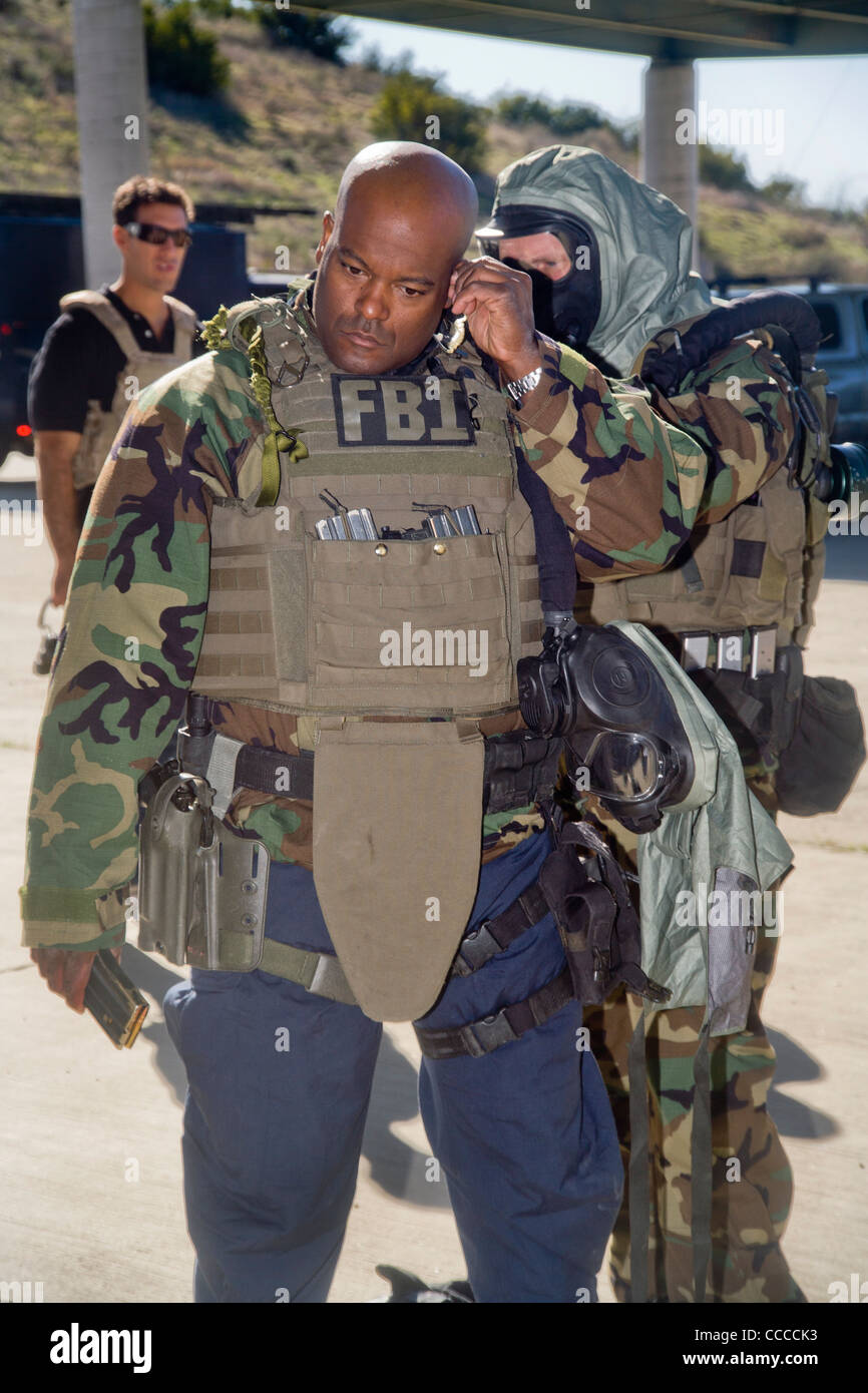 FBI SWAT (Special Weapons and Tactics) team members don specialized  "Weapons of Mass Destruction" equipment for training drills Stock Photo -  Alamy