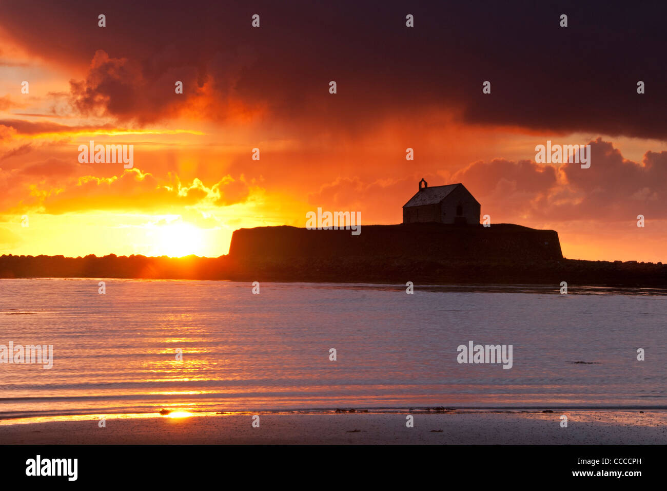 St Cwyfan's Church at Sunset, Aberffraw, Anglesey, North Wales, UK Stock Photo