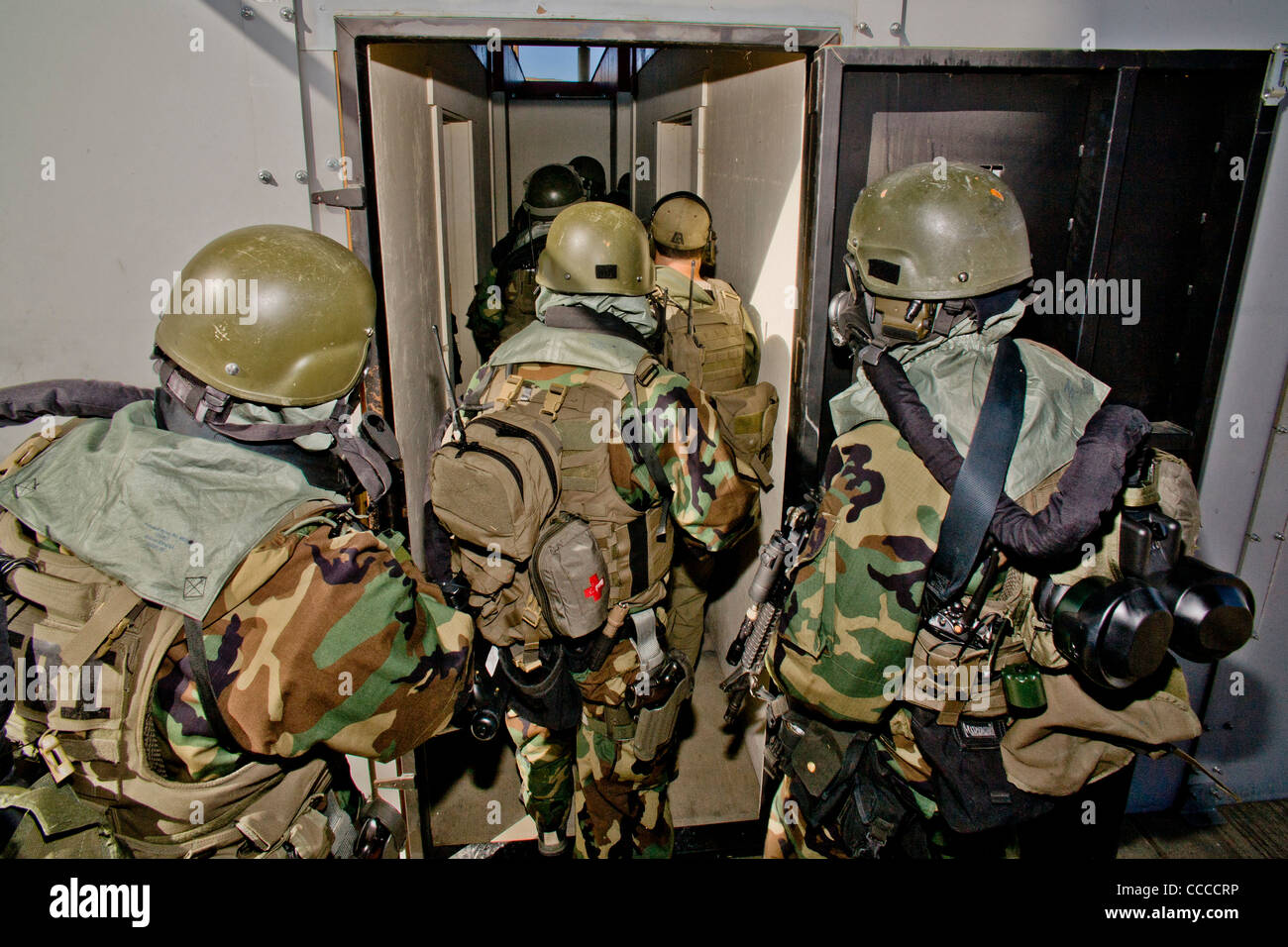 FBI SWAT (Special Weapons and Tactics) team members wear specialized 'Weapons of Mass Destruction' equipment during training. Stock Photo