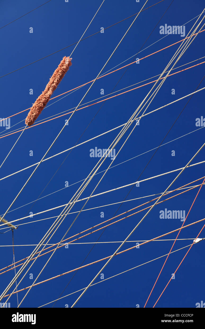 blue sky through the wires, rope detail, rigging of boat Stock Photo