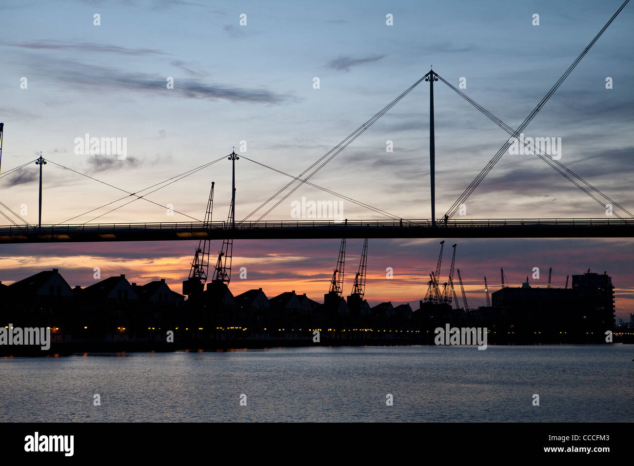 Dusk silhouette shot of the Royal Victoria Dock Bridge by Excel London Docklands Stock Photo
