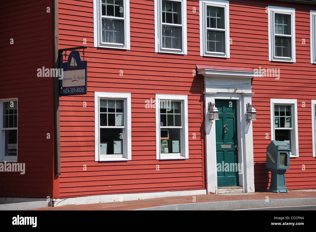 An old red building now housing a Real Estate business, in the historic town of Portsmouth, New Hampshire Stock Photo