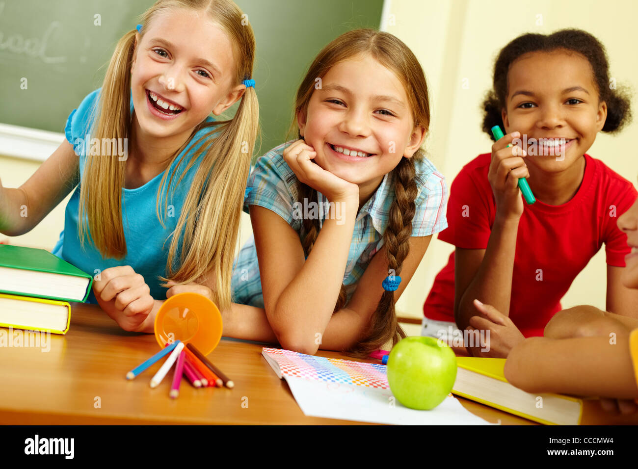 Portrait of joyful schoolgirls laughing in classroom Stock Photo - Alamy