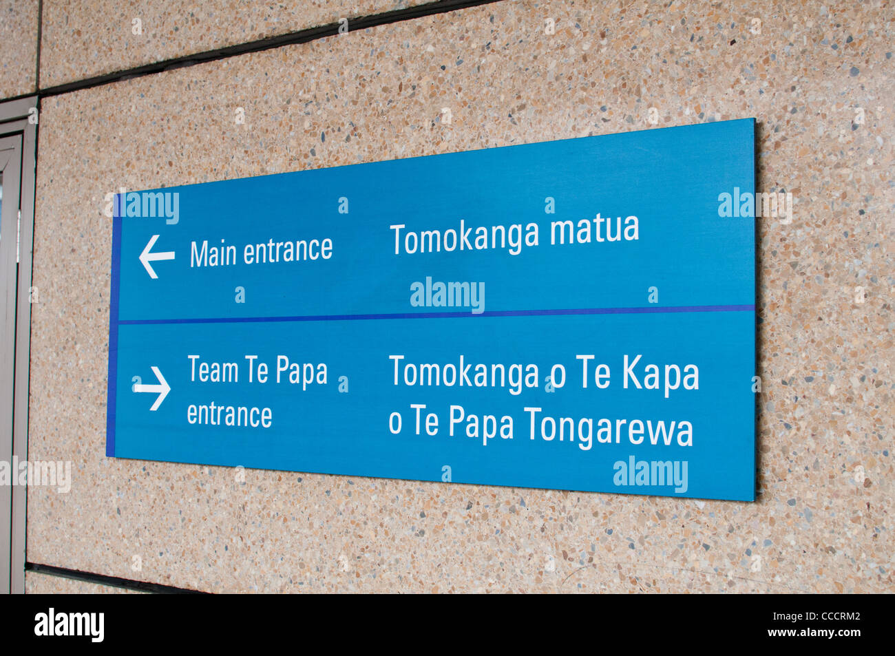 Multi-lingual Maori and England direction signs at the New Zealand National Museum Te Papa in Wellington. Stock Photo