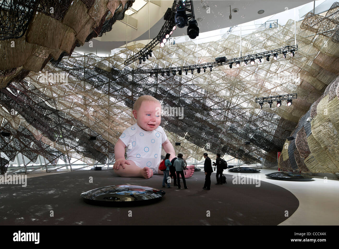 Spain''S Pavilion Is Made Of Wicker On The Exterior. It Features A Giant Animated Baby Installation.It Is Built By Miralles Stock Photo