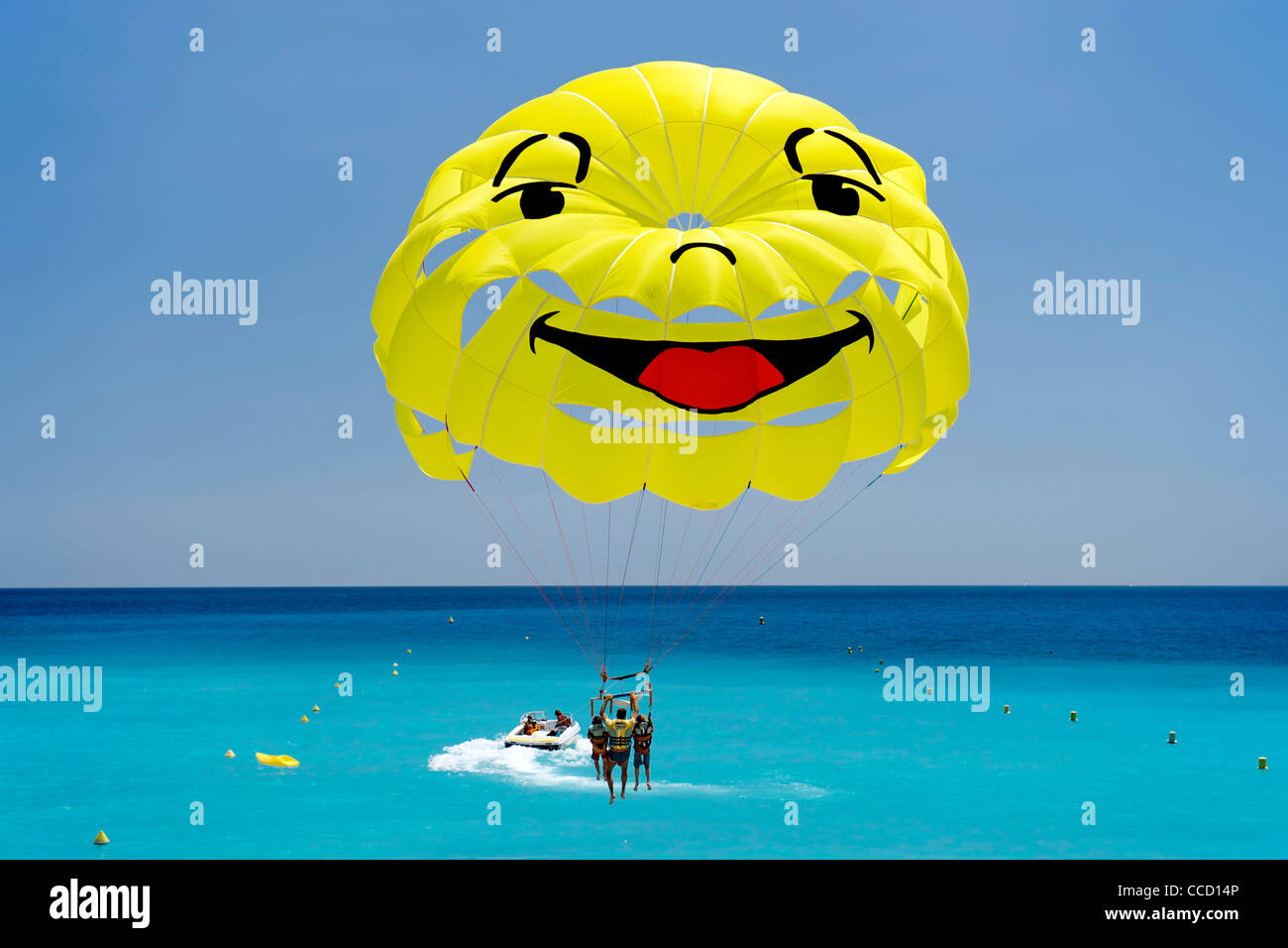 Smiley-faced parasail in the Baie des Anges (Bay of Angels) in Nice on the Mediterranean coast in southern France. Stock Photo
