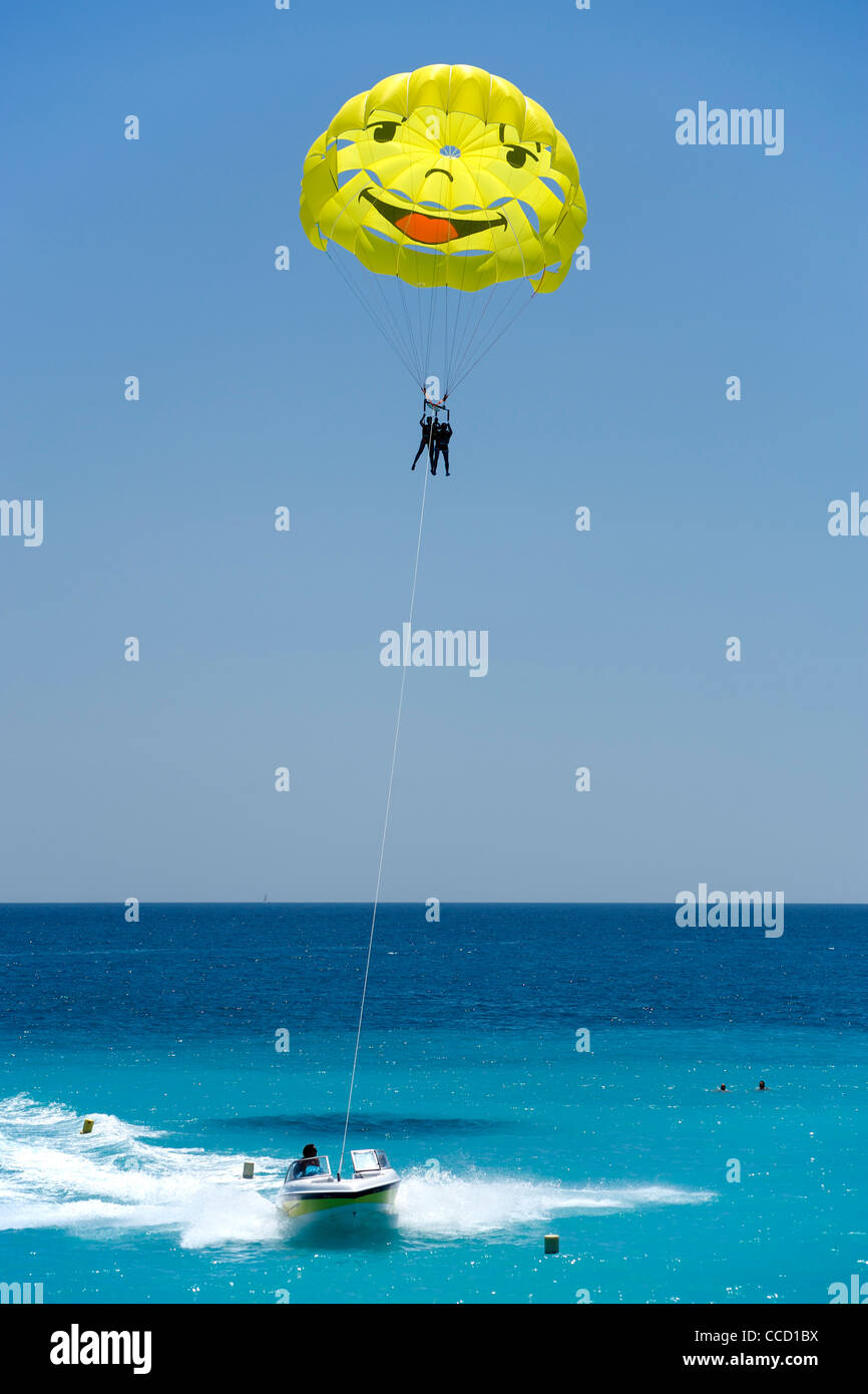 Smiley-faced parasail in the Baie des Anges (Bay of Angels) in Nice on the Mediterranean coast in southern France. Stock Photo