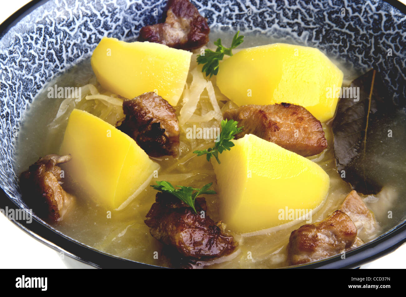 Sauerkraut soup with grilled meat and boiled potatoes Stock Photo