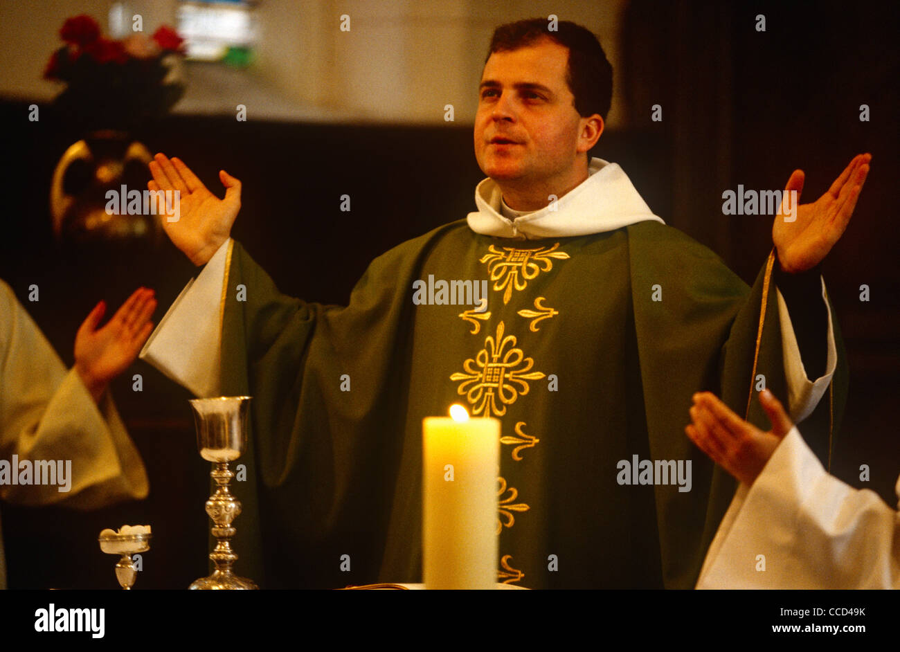 Father Phillipe Dubos, a catholic priest leads Sunday Mass in a local Catholic church in Le Neubourg, Normandy, France. Stock Photo