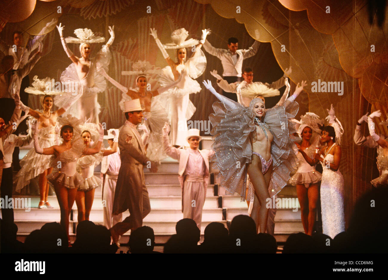On stage, a beautiful topless dancer with a gentleman admirer during a  variety show at the famous Parisian cabaret company Paradis Latin, Paris  France Stock Photo - Alamy