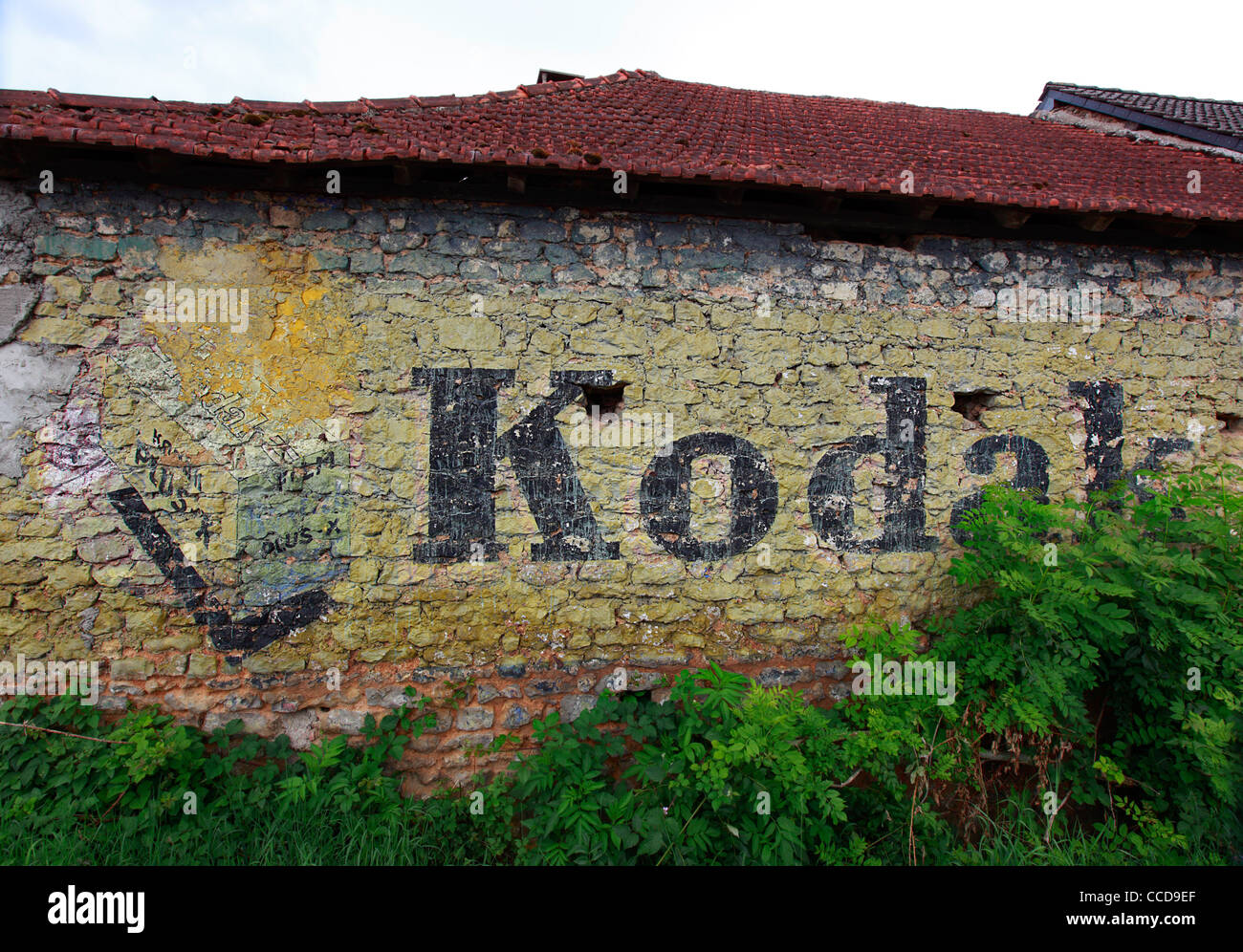 Old Kodak Advertising Mural on Farmhouse Wall in rural France- Close Up Stock Photo