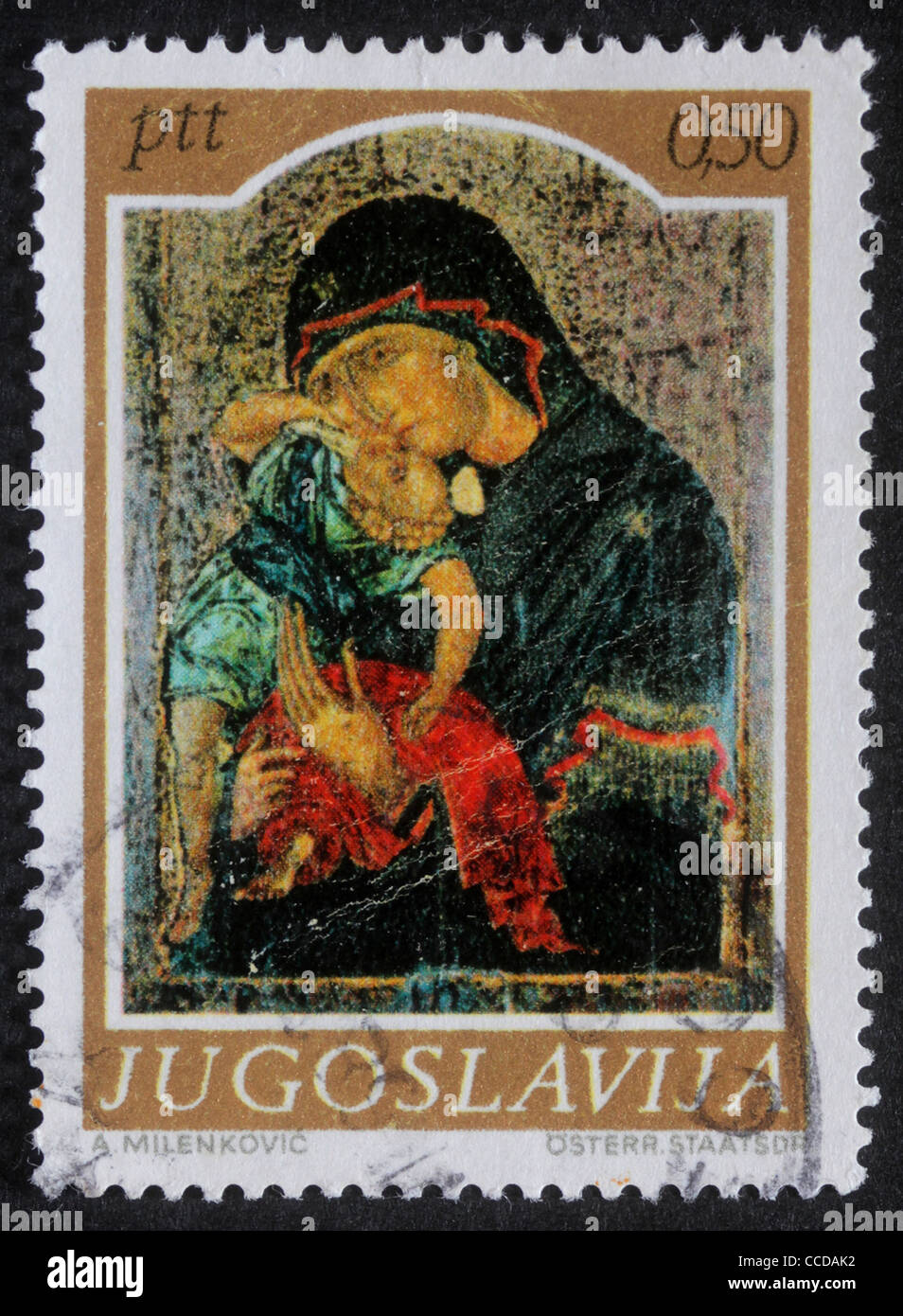 A greeting Christmas stamp printed in Yugoslavia shows Madonna and Child, circa 1985 Stock Photo