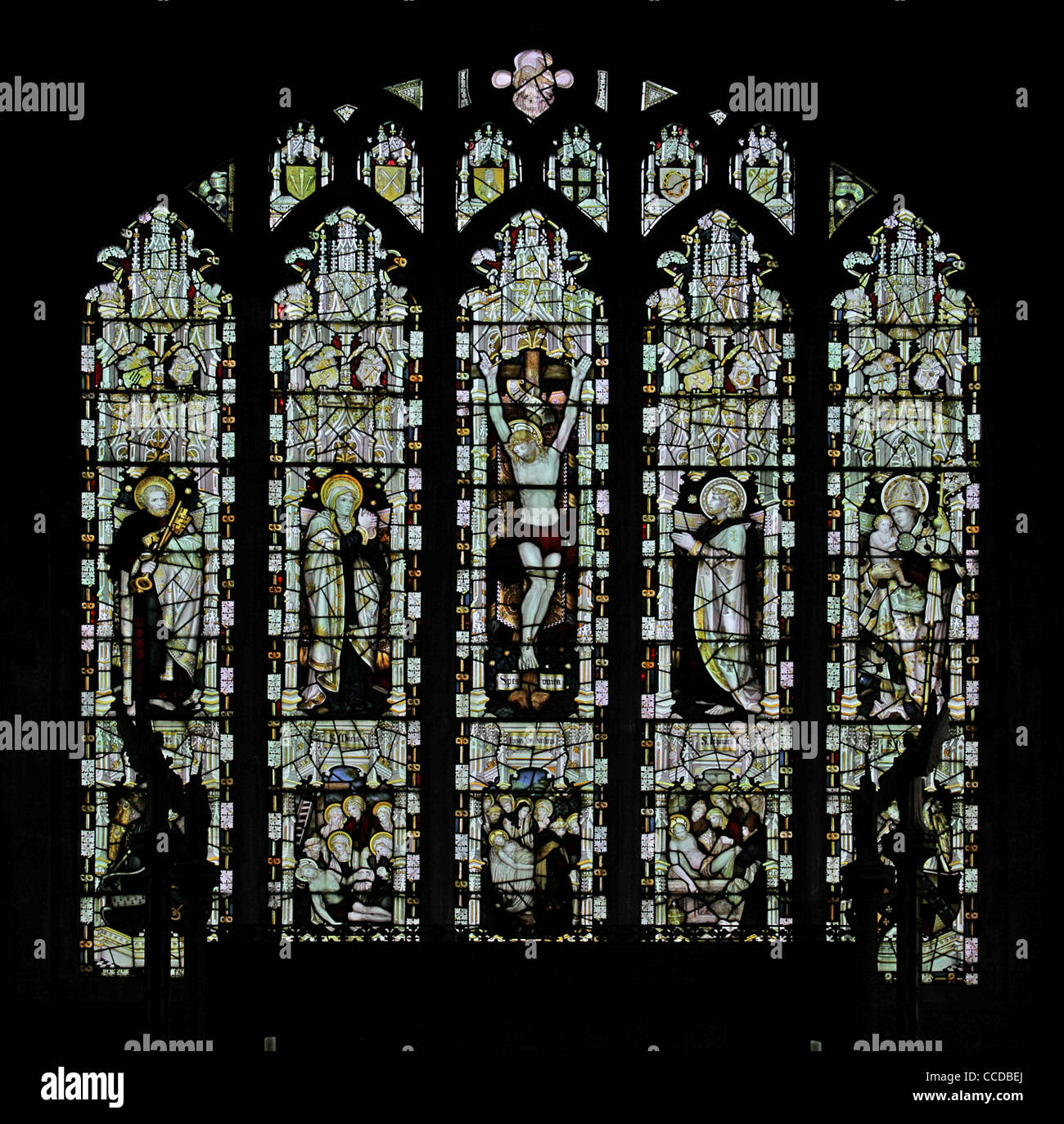 A stained glass window by the Kempe Studios depicting The Crucifixion