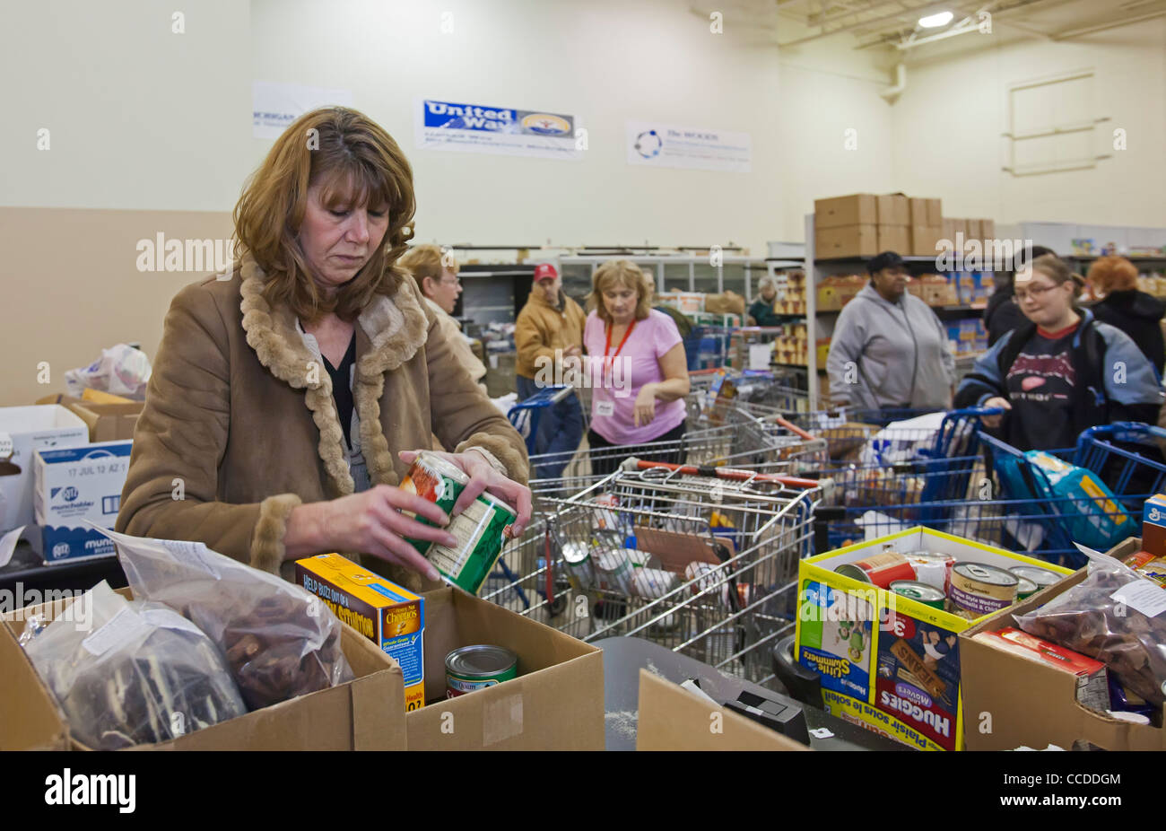 Volunteers Work at Food Pantry Stock Photo