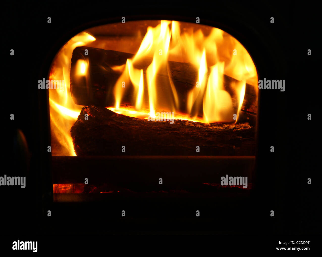 close up of flames of logs burning in a Stovax Stockton 3 log burning stove Stock Photo